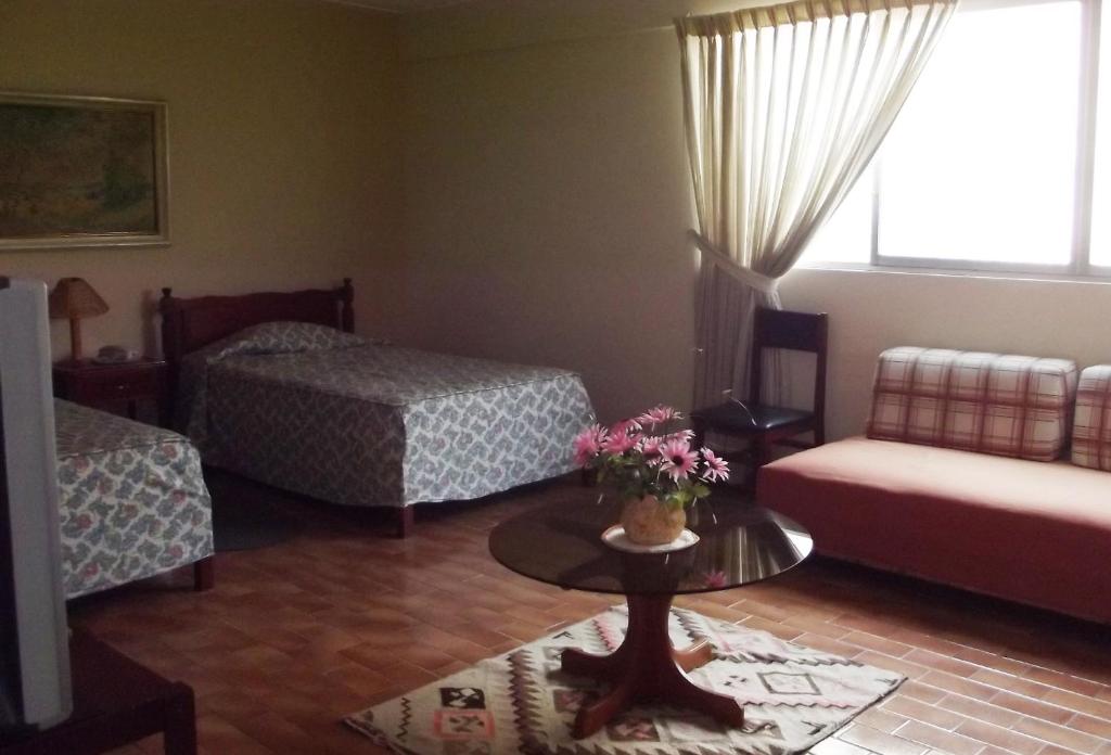 Postel nebo postele na pokoji v ubytování Hostal Gemina