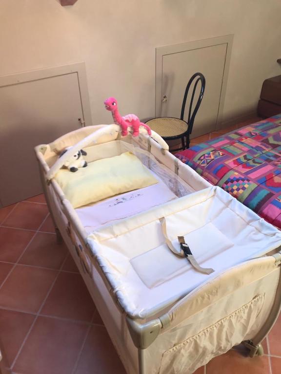 A bed or beds in a room at Mansarda Margherita