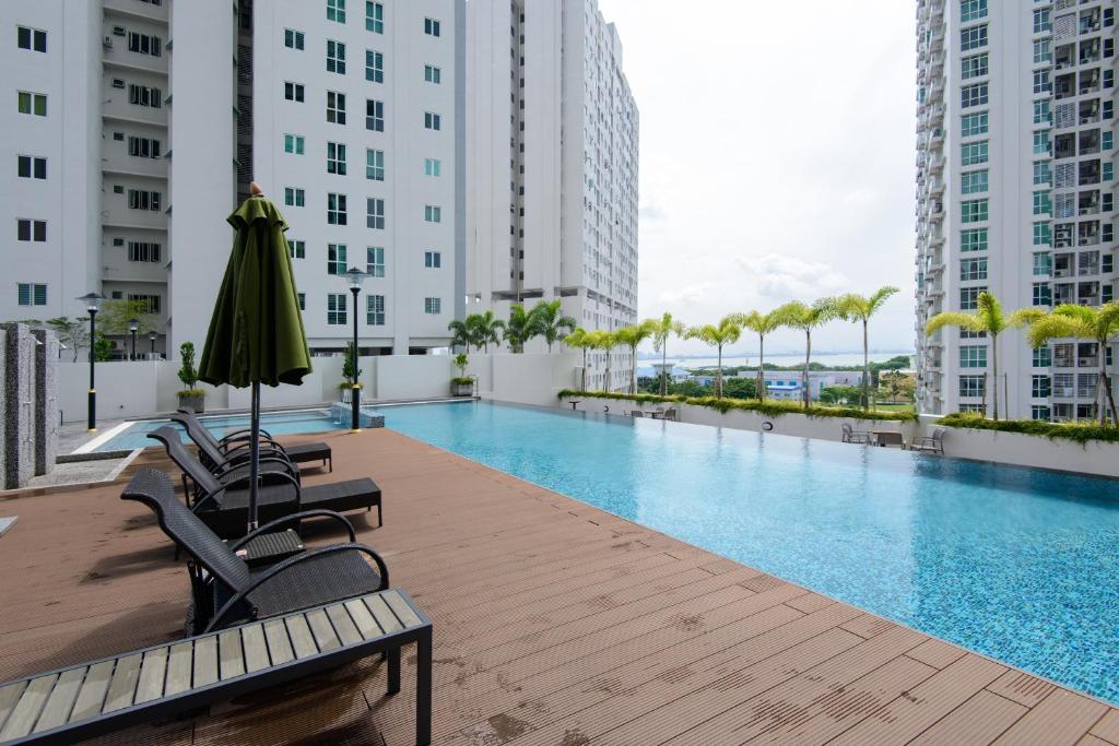 a swimming pool on the roof of a building at Straits Garden Suites, Georgetown in George Town