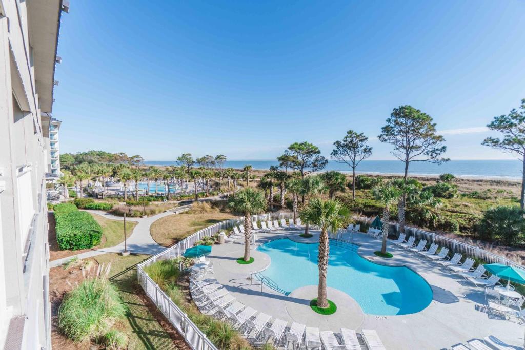 an aerial view of the pool at the resort at Stunning Views!!-Oceanfront Villa-Heated Pool-Private Balcony-Tiki Bar-Walk to Coligny Plaza in Hilton Head Island