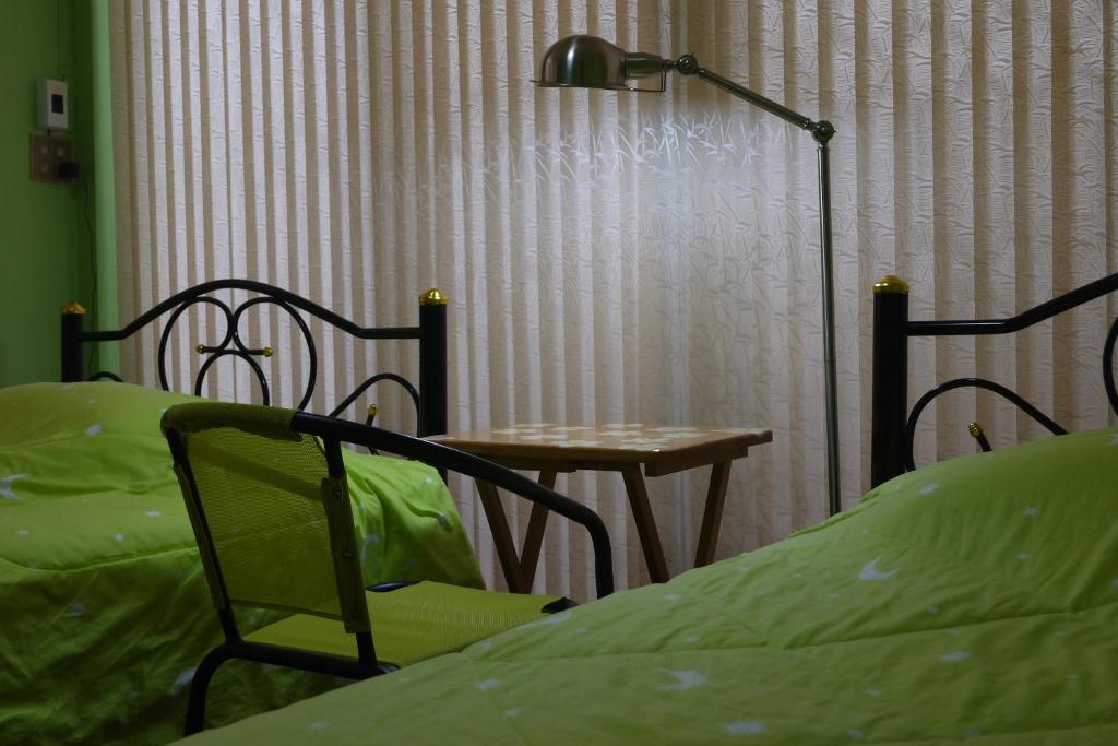 Postel nebo postele na pokoji v ubytování Punnpannsuk