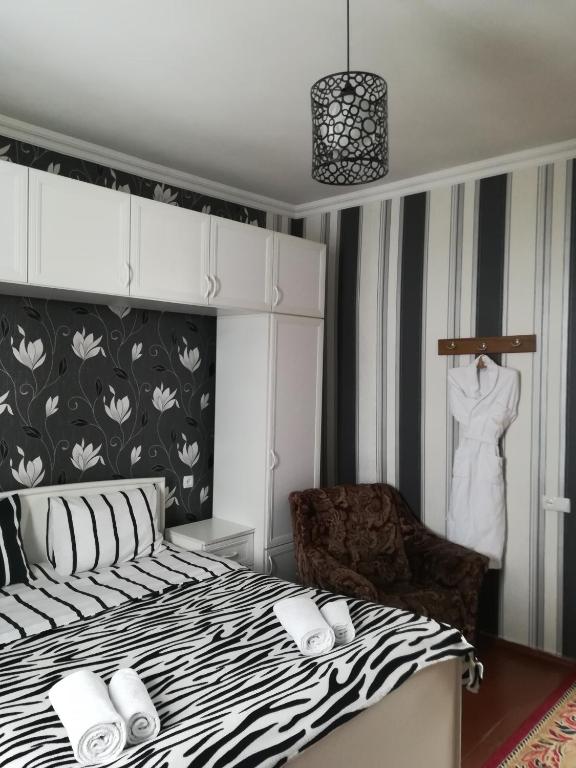 Postel nebo postele na pokoji v ubytování Nikoloz Guesthouse