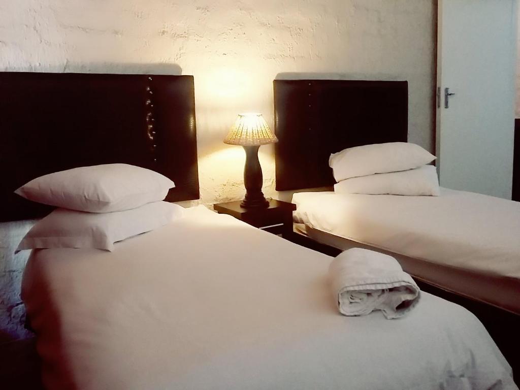 Ένα ή περισσότερα κρεβάτια σε δωμάτιο στο Bains Lodge