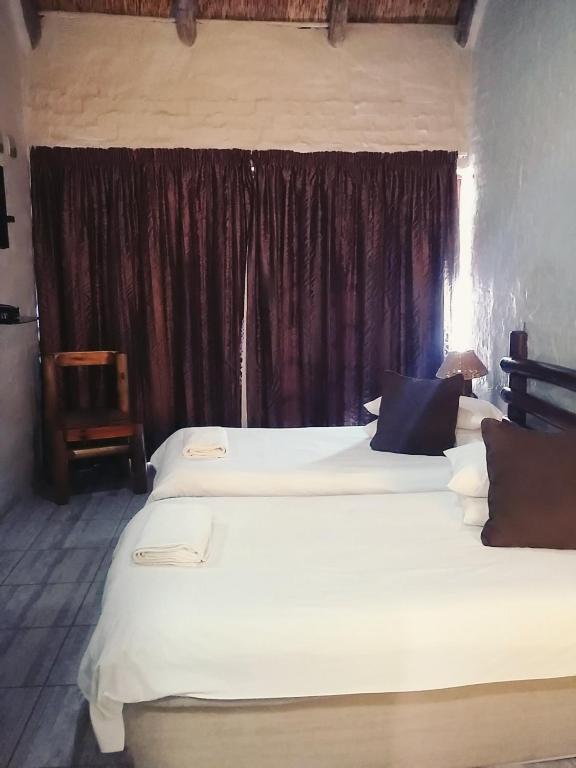 Ένα ή περισσότερα κρεβάτια σε δωμάτιο στο Bains Lodge