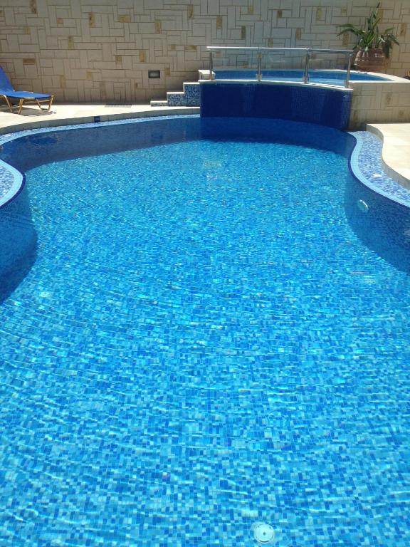 The swimming pool at or close to Angelica Studios and Apartments