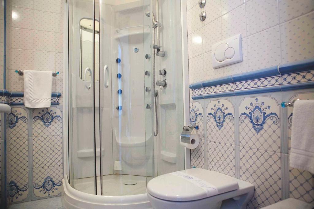 a bathroom with a shower and a toilet at Hotel Voce del Mare in Vietri sul Mare