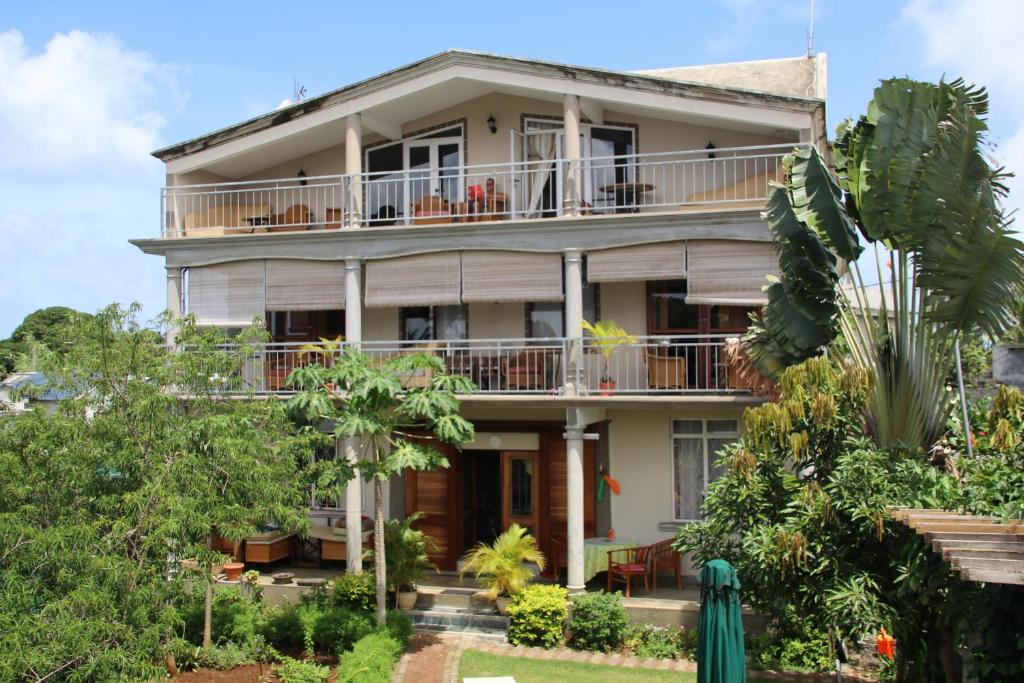 an image of a house with trees at Shanti Nivas in Post of Flacq