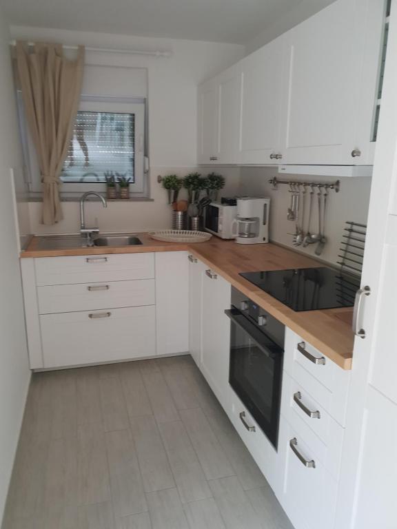 Kuchyň nebo kuchyňský kout v ubytování Apartment Rina Deluxe