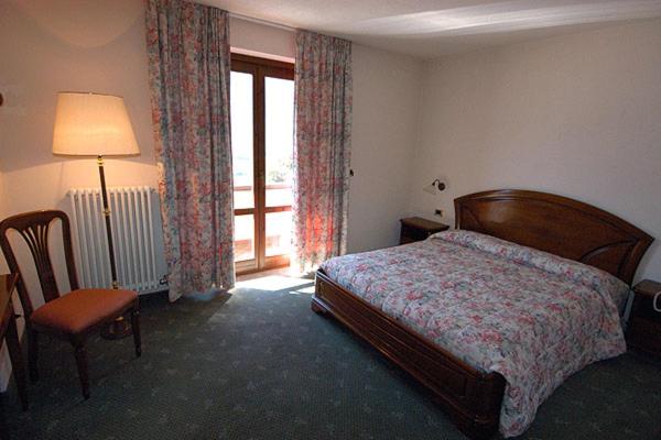 Postel nebo postele na pokoji v ubytování Hotel Panoramique