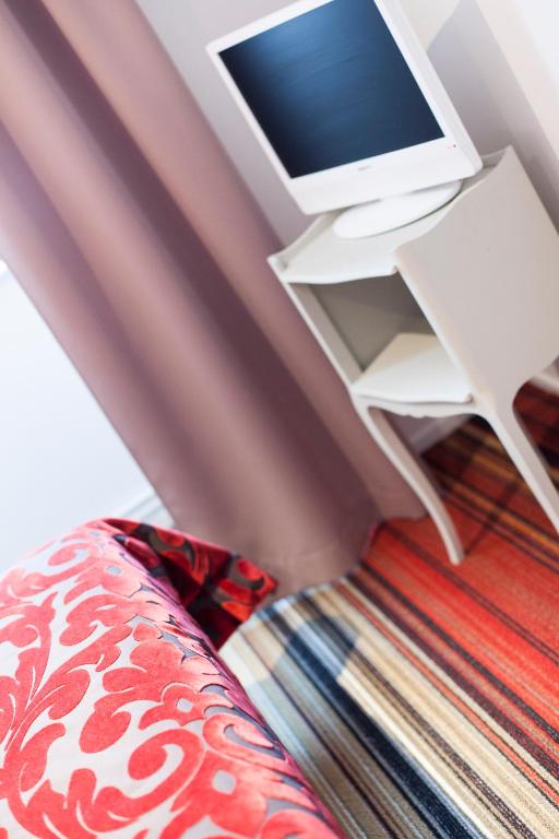 TV a/nebo společenská místnost v ubytování Hotel Athanor Centre