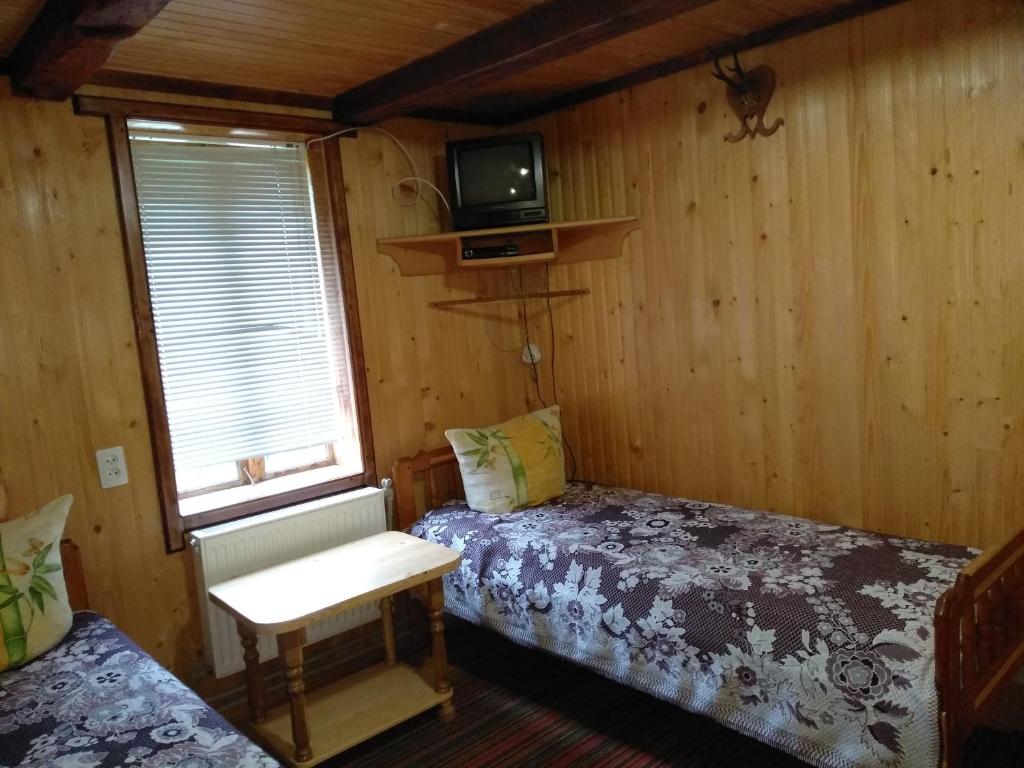 Postel nebo postele na pokoji v ubytování Sadiba Pid Skeleyu