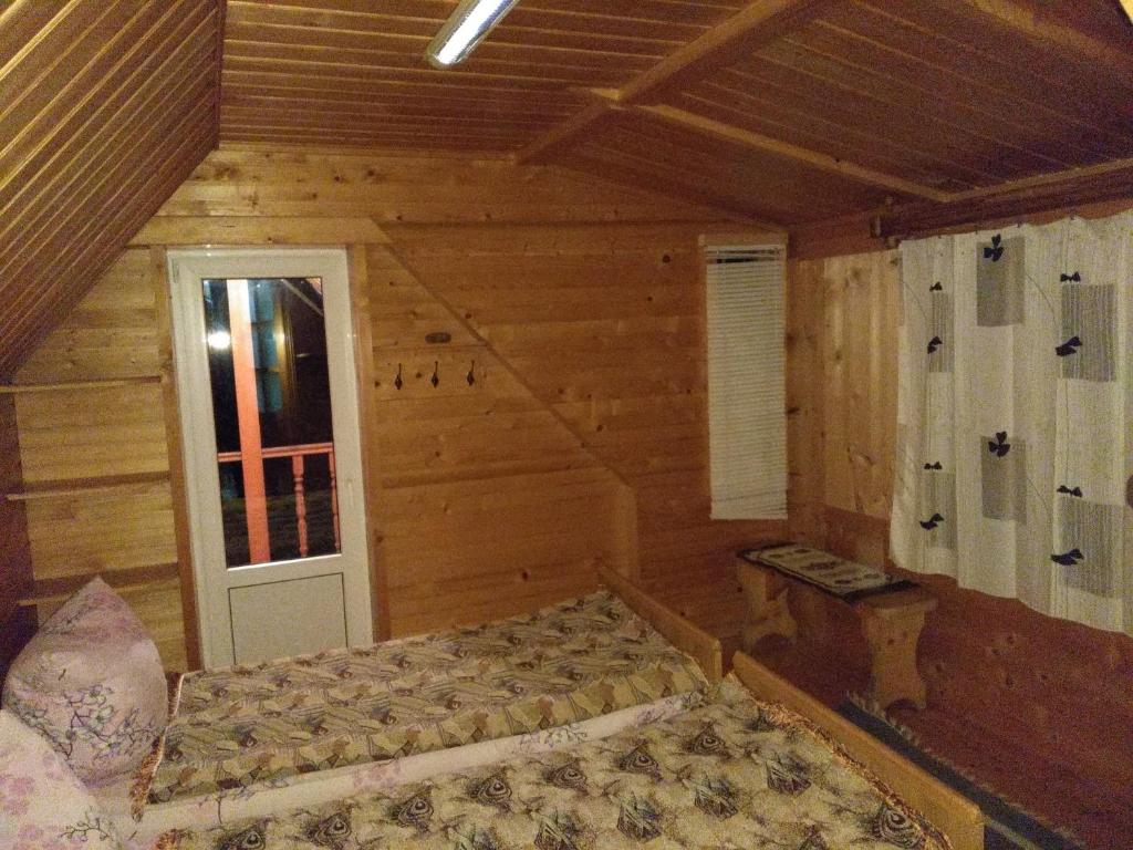 Postel nebo postele na pokoji v ubytování Sadiba Pid Skeleyu