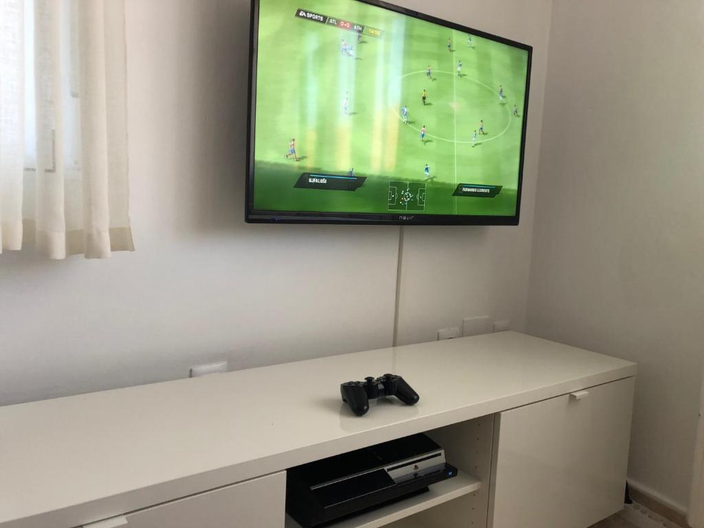 Televízia a/alebo spoločenská miestnosť v ubytovaní Casa Fuente Arriba