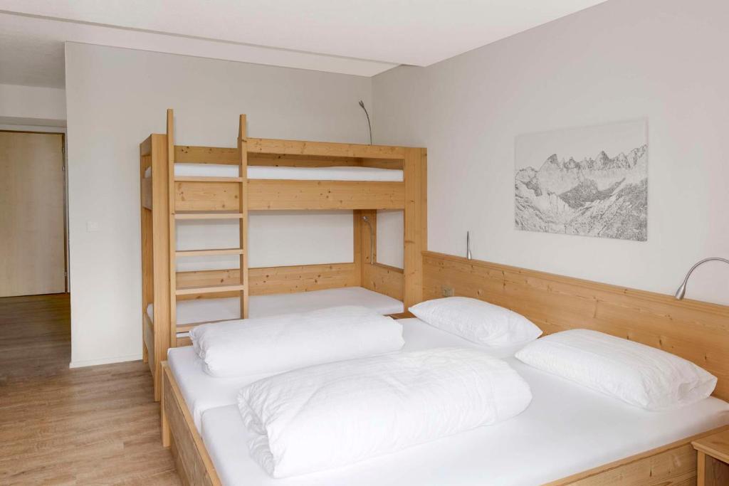 Voodi või voodid majutusasutuse Berghotel Bischofalp toas
