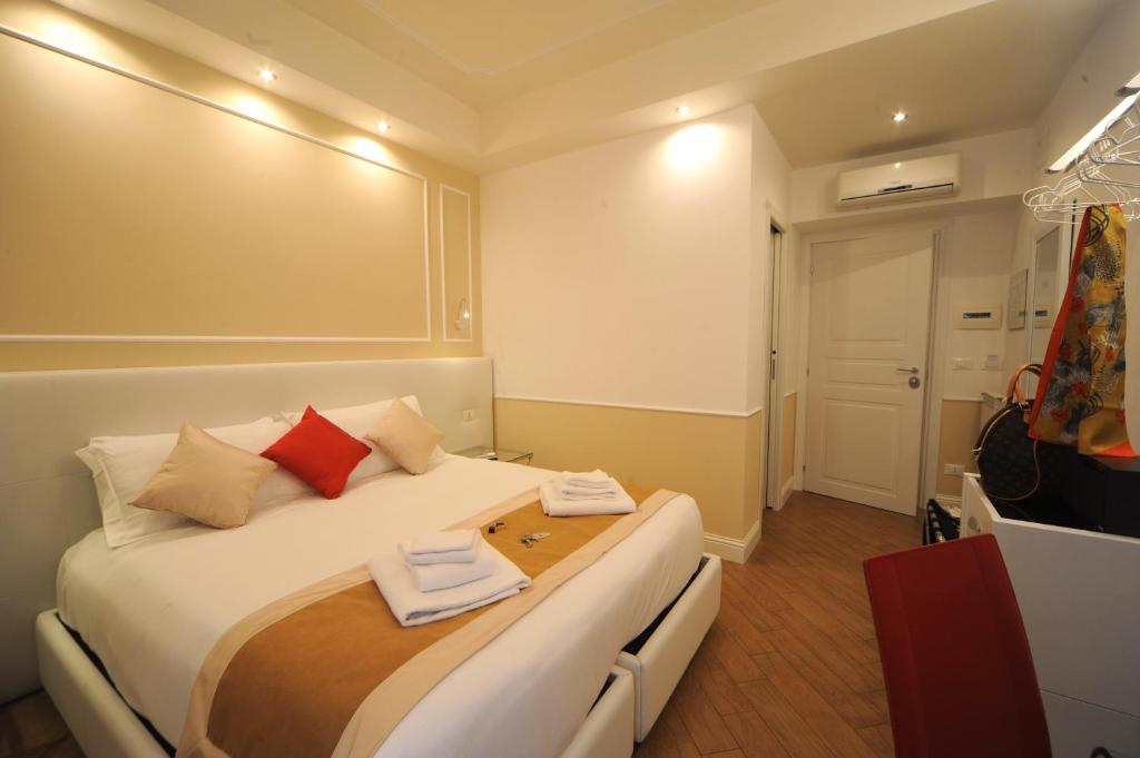 Posteľ alebo postele v izbe v ubytovaní My Suites Piazza di Spagna