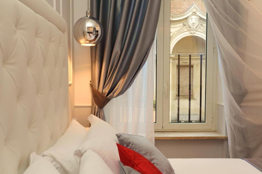 Posteľ alebo postele v izbe v ubytovaní My Suites Piazza di Spagna