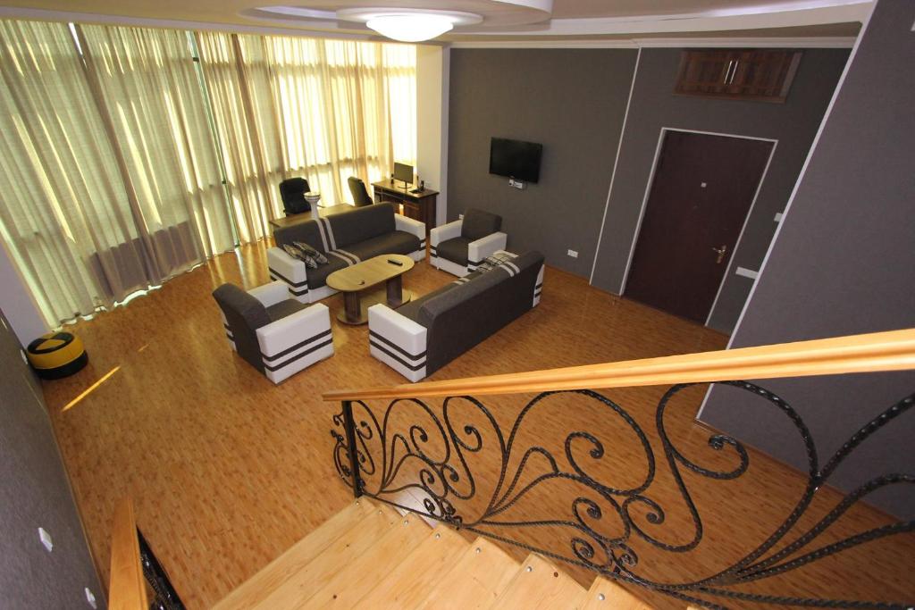 an overhead view of a living room with couches at Rustaveli 106 in Kutaisi