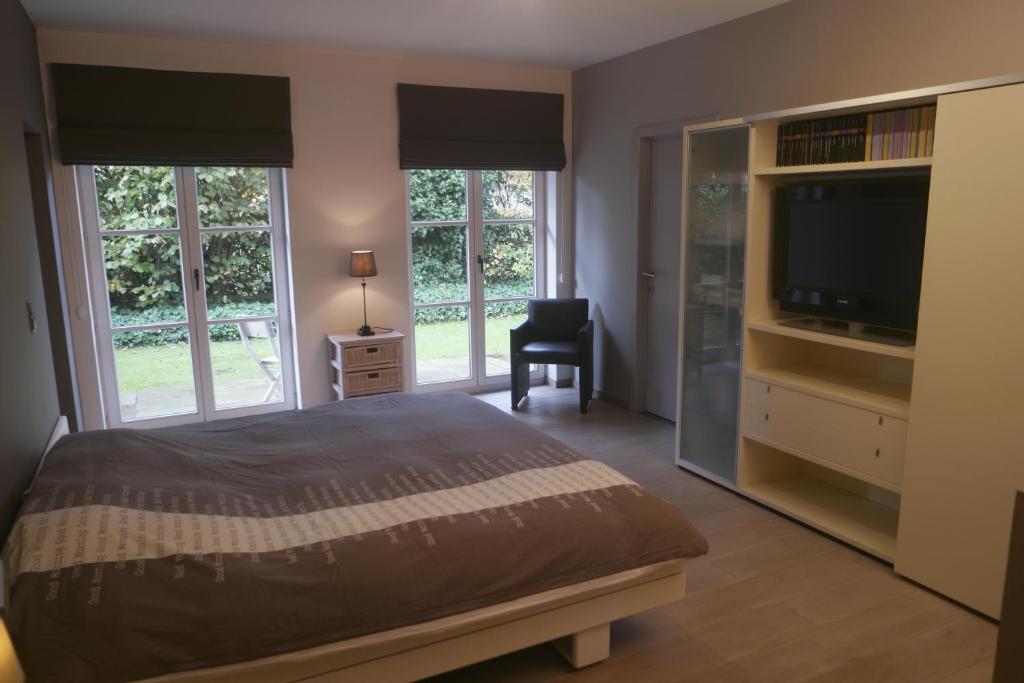 Postel nebo postele na pokoji v ubytování Villa Kokeliko