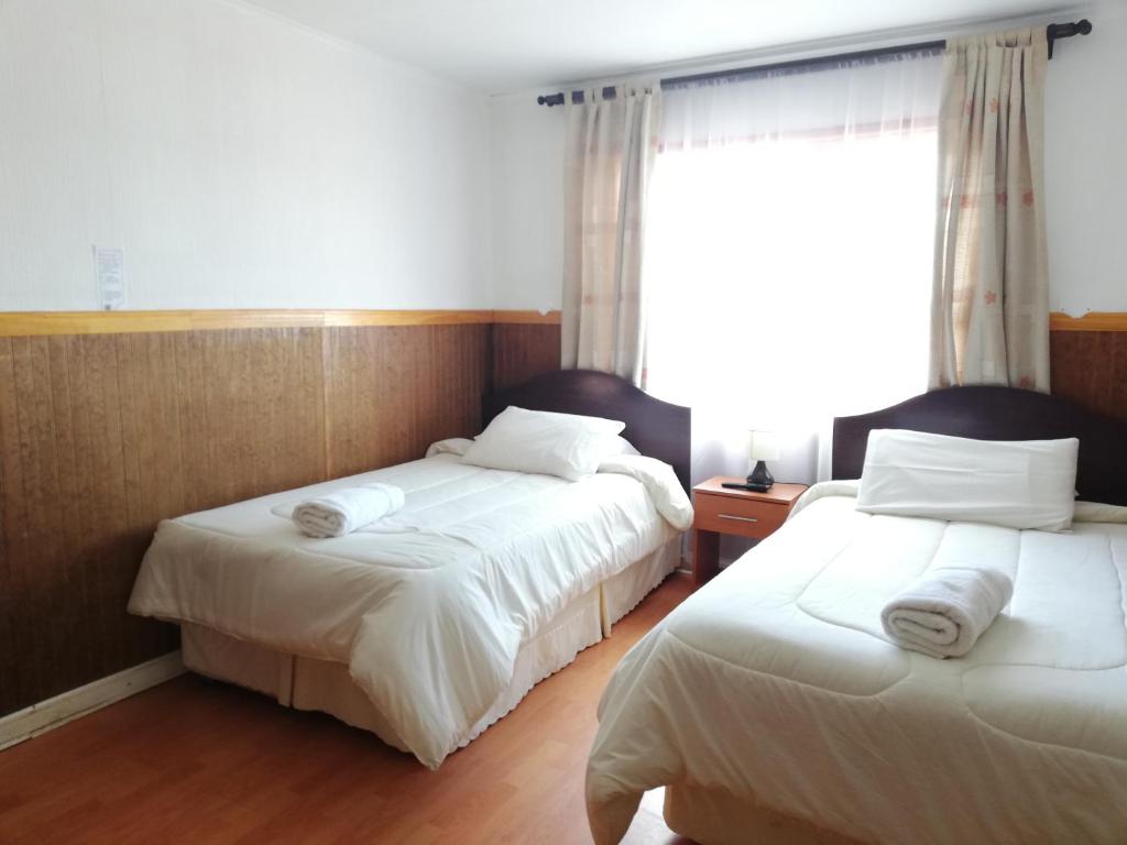 Postel nebo postele na pokoji v ubytování Agostini Hotel