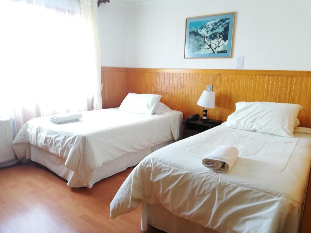 Postel nebo postele na pokoji v ubytování Agostini Hotel