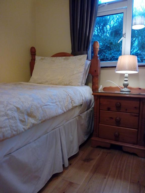 Postel nebo postele na pokoji v ubytování Corrib View Guesthouse h91rr72