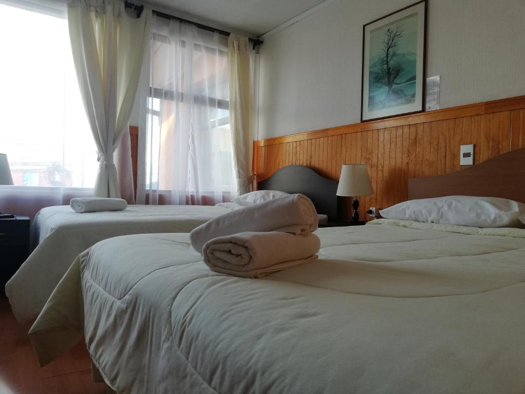 Postel nebo postele na pokoji v ubytování Agostini Hotel