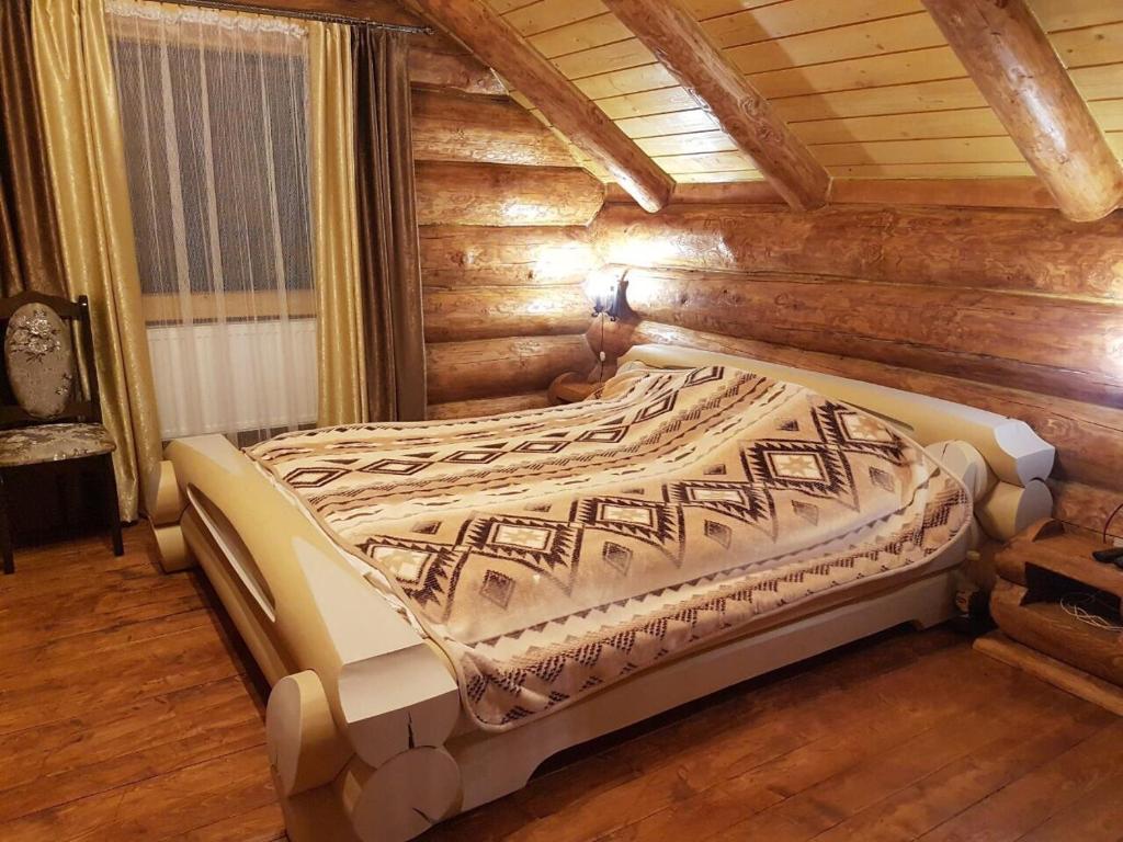 Postel nebo postele na pokoji v ubytování Зимова казка