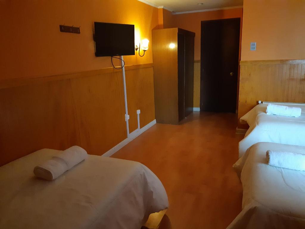 Postel nebo postele na pokoji v ubytování Agostini Hotel