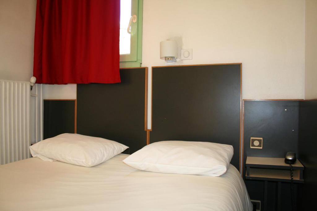 Postel nebo postele na pokoji v ubytování Hôtel La Chartreuse