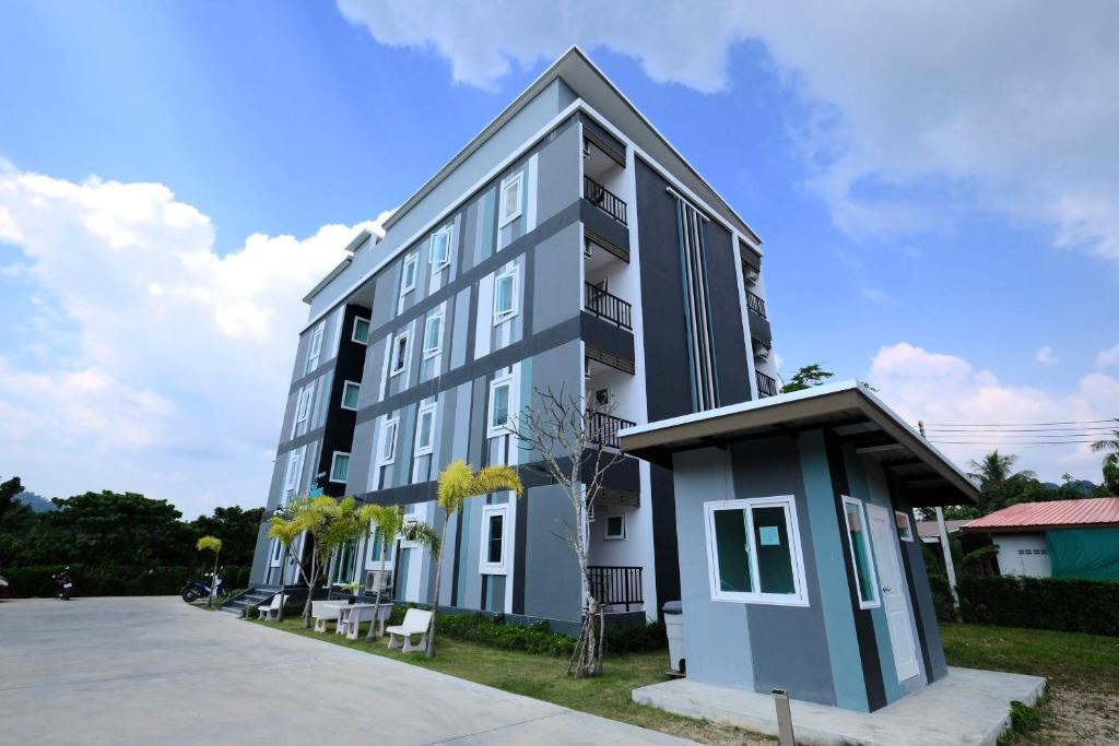 a white and blue building with aventh floor at Living at Sphere Apartment in Ao Nang Beach