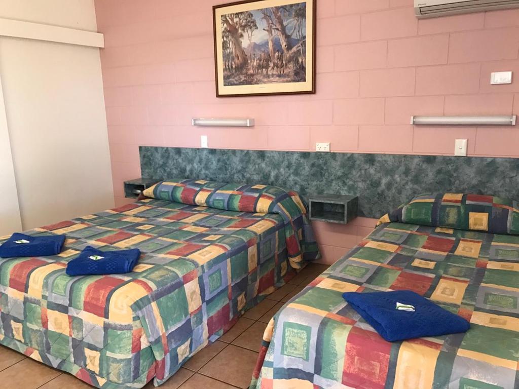 Postel nebo postele na pokoji v ubytování Wagon Wheel Motel