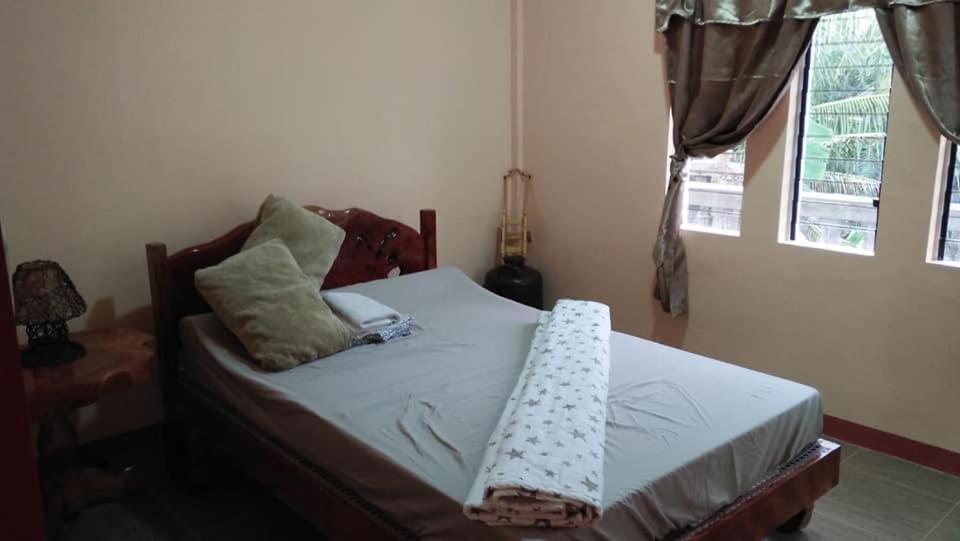 Postel nebo postele na pokoji v ubytování Anvel Homestay