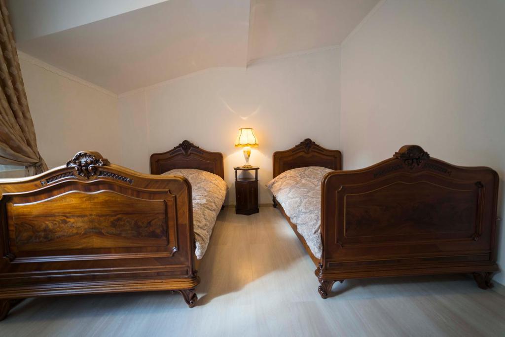 Postel nebo postele na pokoji v ubytování Ikonomov House