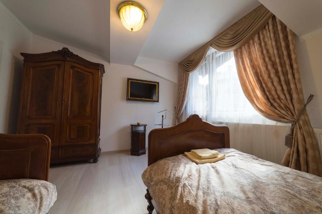 Postel nebo postele na pokoji v ubytování Ikonomov House