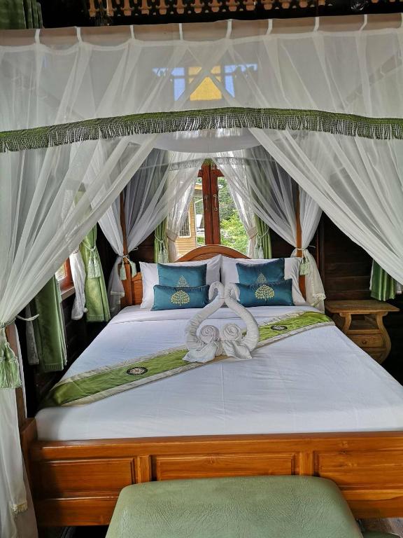 Katil atau katil-katil dalam bilik di Baan Sithepaban Guesthouse