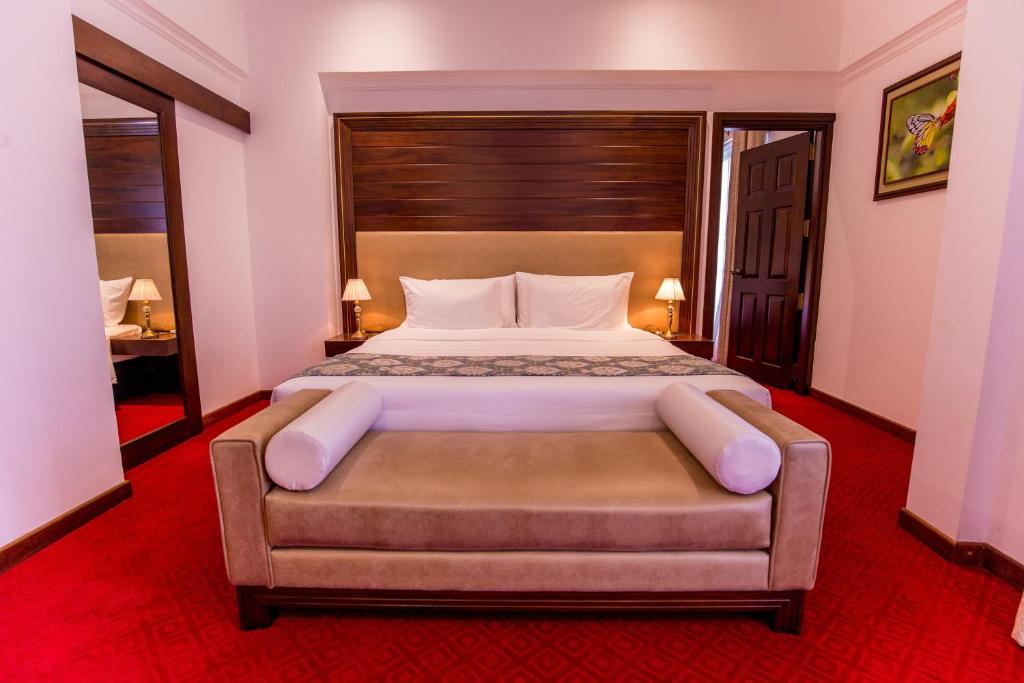 Postel nebo postele na pokoji v ubytování Trillium Boutique City Hotel