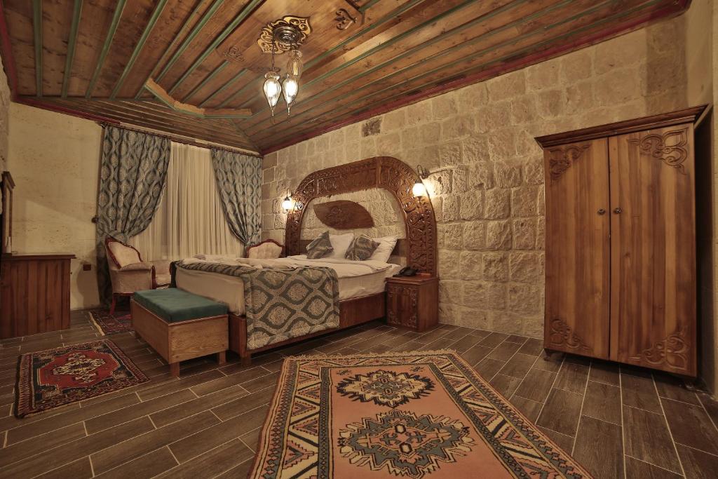Postel nebo postele na pokoji v ubytování Grand Cappadocia Hotel