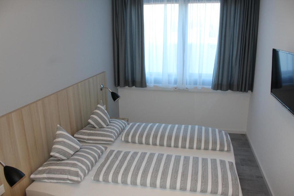 Postel nebo postele na pokoji v ubytování Hotel Lumi