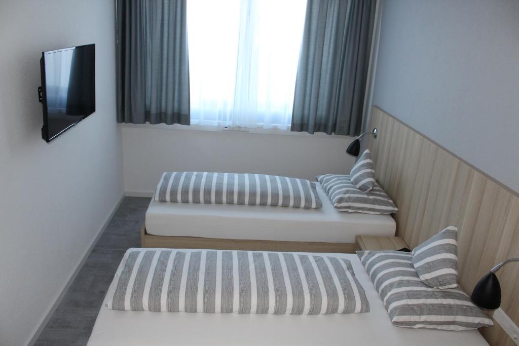 Postel nebo postele na pokoji v ubytování Hotel Lumi