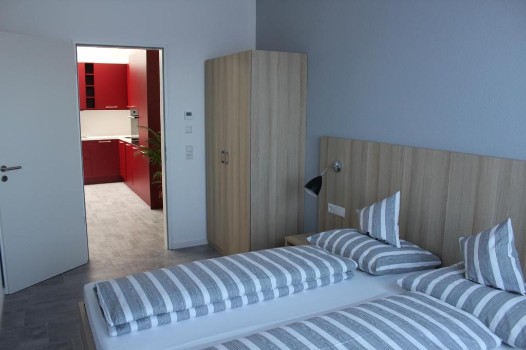 Postel nebo postele na pokoji v ubytování Hotel Lumi