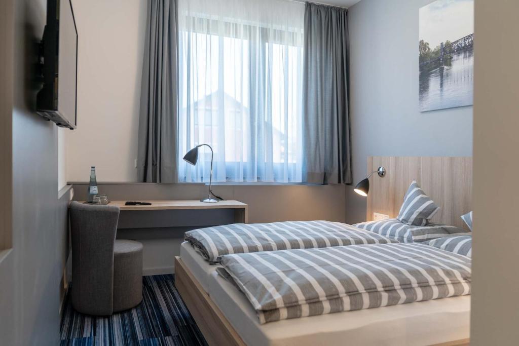 Postel nebo postele na pokoji v ubytování Hotel Lumi