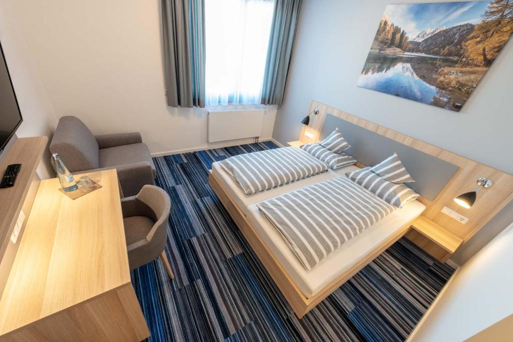 Postel nebo postele na pokoji v ubytování Hotel Lumi