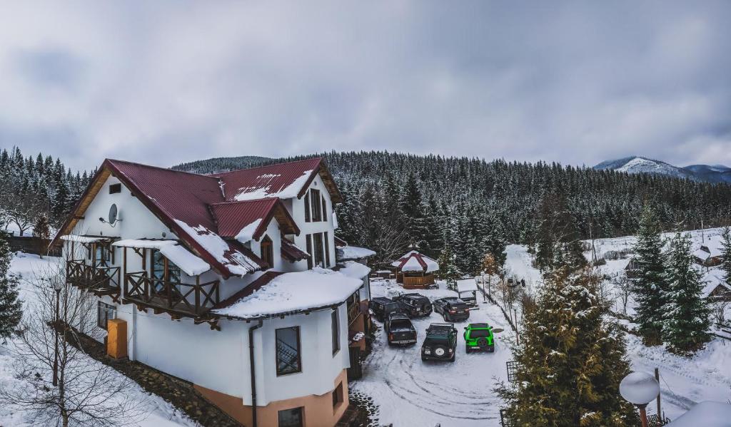 an aerial view of a house in the snow at 12 Months Estate in Myslovka