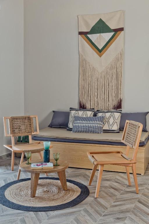 a living room with a couch and two chairs at Kalimera Karpathos Exclusive Villas in Afiartis