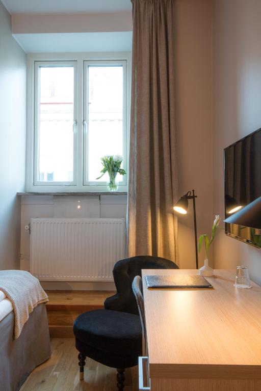Postel nebo postele na pokoji v ubytování Hotell Aston