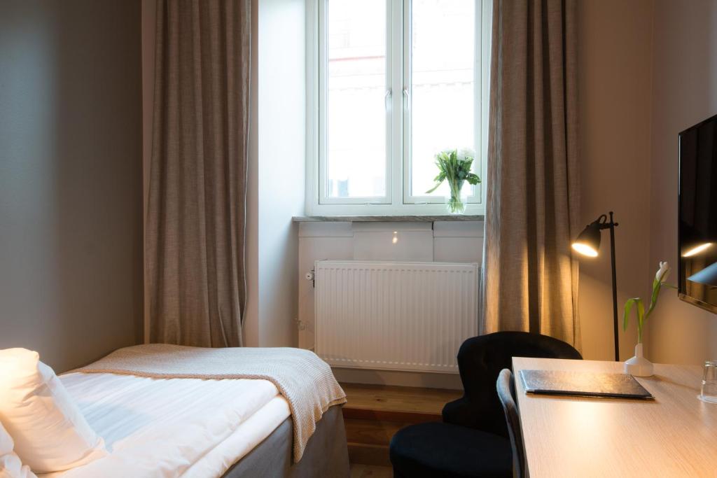 Postel nebo postele na pokoji v ubytování Hotell Aston