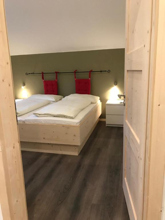 Postel nebo postele na pokoji v ubytování Alpenlodge Kirchbach