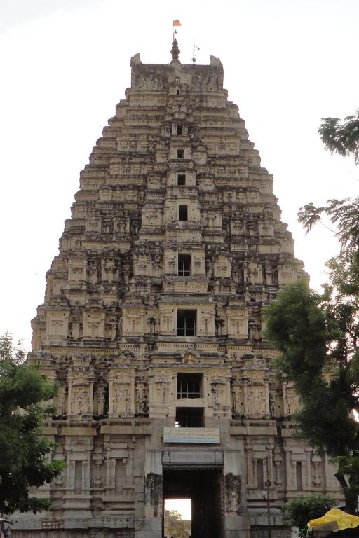 a large temple building with a tower at Rks Homestay in Hampi