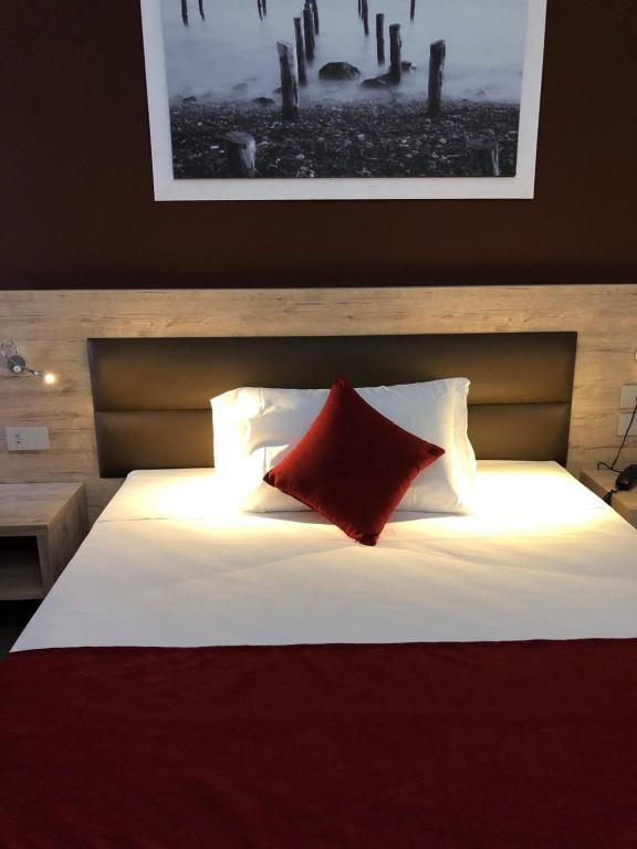 Postel nebo postele na pokoji v ubytování Hotel Stradivari