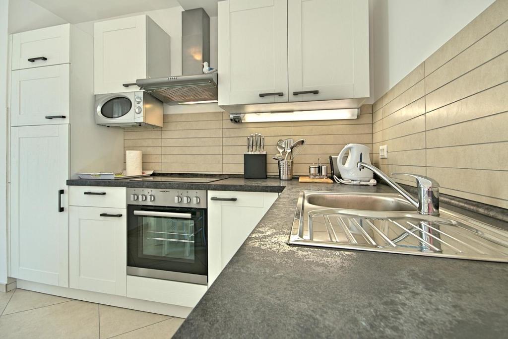 Kuchyň nebo kuchyňský kout v ubytování Luxury Stone Villa Zanelli